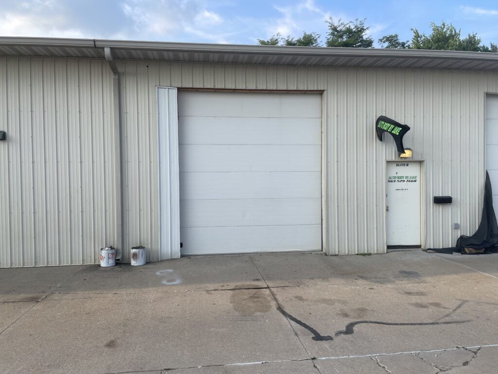 48′ x 50′ x 14′ heated commercial - warehouse with regular door and two 11′ x 11′ roll-up doors (only one shown) can be used for business or as a storage unit in Davenport, Iowa