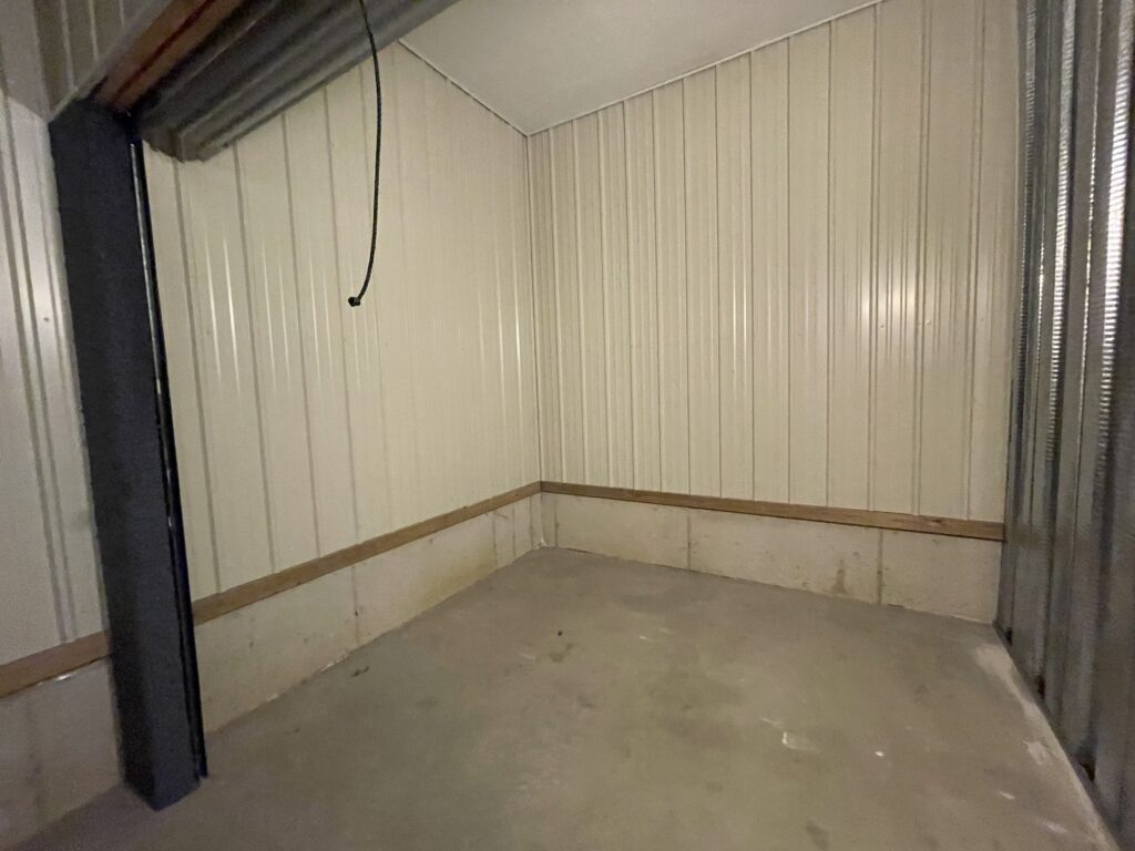 Door open on 10′ x 10′ x 9′ Climate-Controlled Storage Unit at Davenport Storage Center in Davenport, Iowa - Unit 311 (looking in)