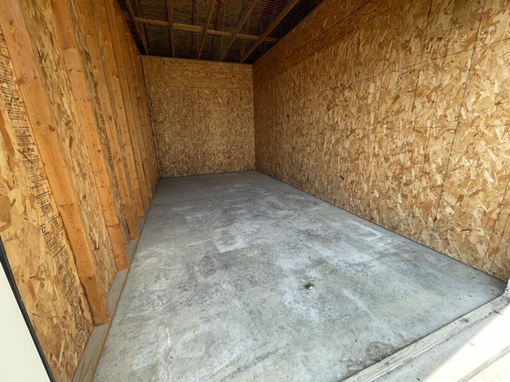 Inside 10′ x 20′ x 9′ drive-up storage units with 8′ x 8′ roll-up door in Davenport, Iowa - From the front