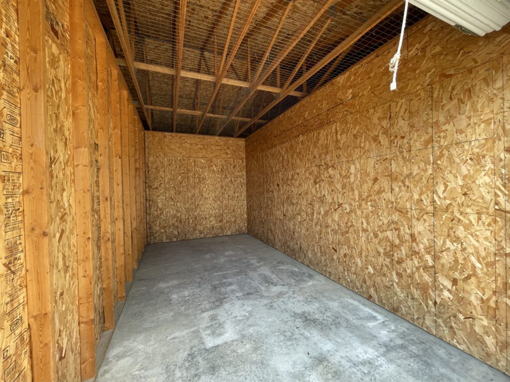 Inside 10′ x 20′ x 9′ drive-up storage units with 8′ x 8′ roll-up door in Davenport, Iowa - Looking to the back