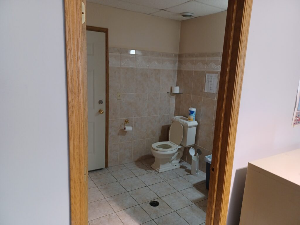 Toilet in the second bathroom at Commercial-Office Space in Davenport, Iowa.