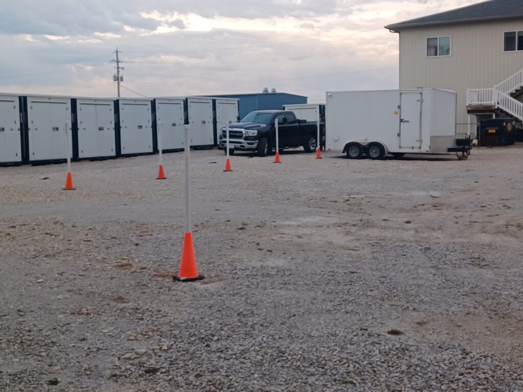 RV & Boat Storage Area in Davenport, Iowa at Davenport Storage Center view of a driving area between storage units.